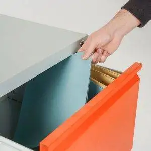 Orange filing cabinet with lockable drawers for document insertion