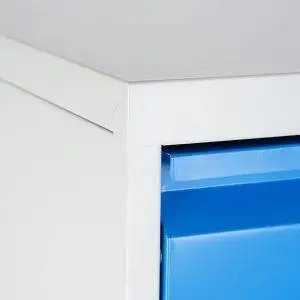 Filing chest of drawers with blue drawers with lock, metal corner detail